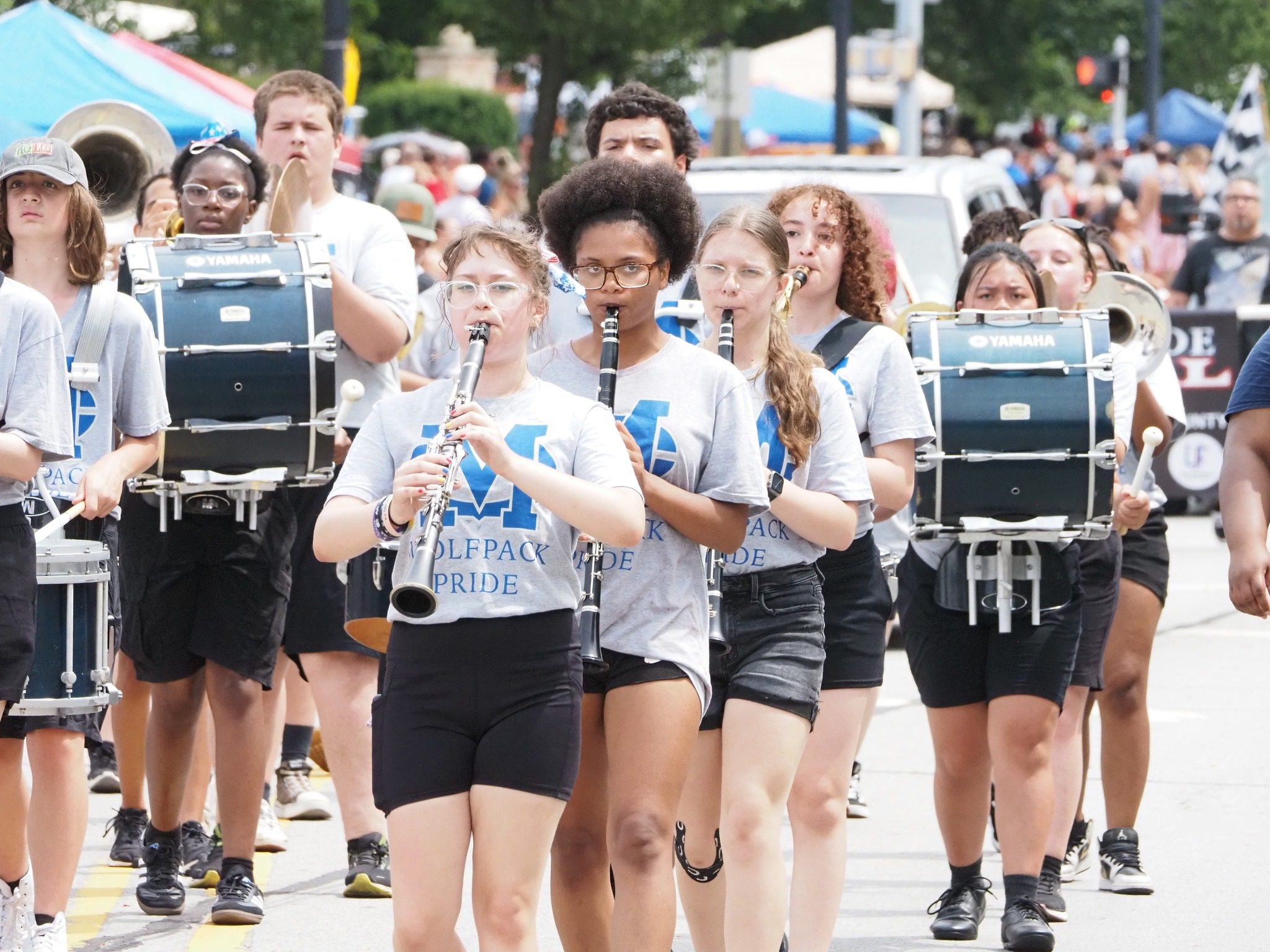 Local marching band performing in the Kiwanis Fourth of July Parade in LaPorte, Indiana with students playing instruments along the parade route. Local marching band performing in the Kiwanis Fourth of July Parade in LaPorte, Indiana with students playing instruments along the parade route.