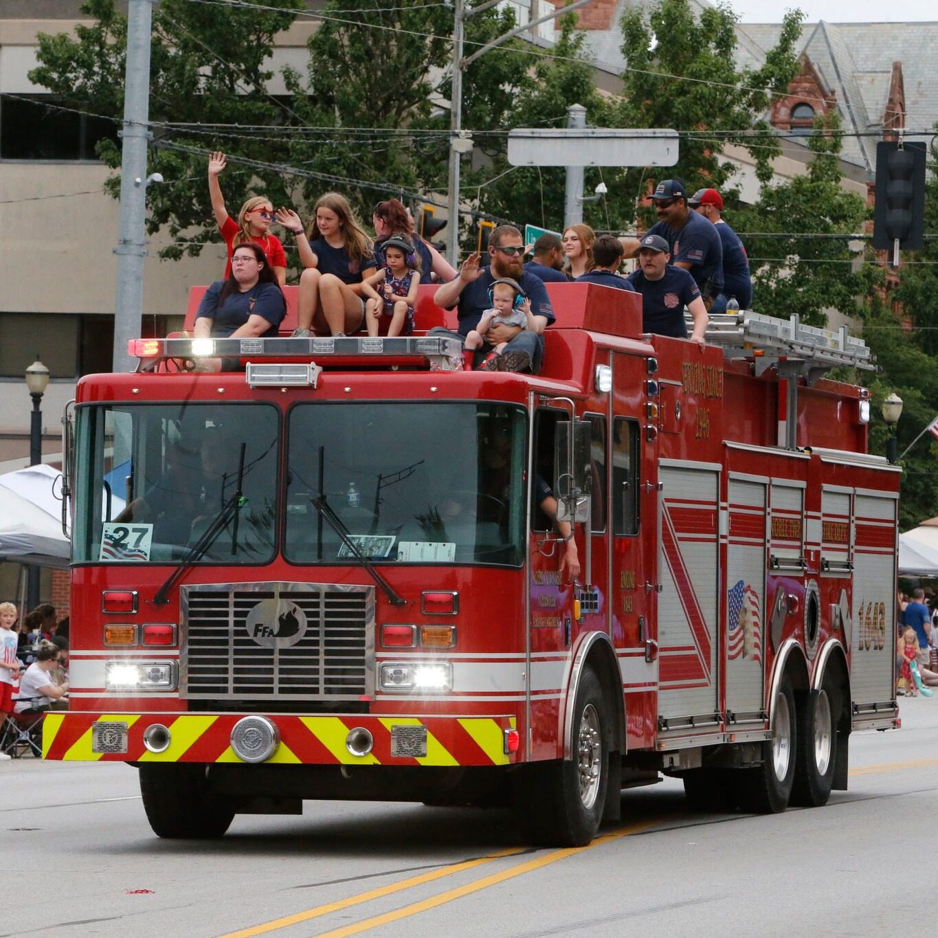 LaPorte Fire Department fire engine driving down the parade route during the Kiwanis Fourth of July Parade in downtown LaPorte, Indiana.